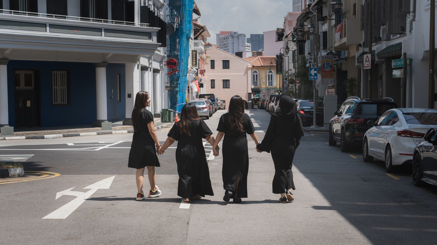 Group walking down a heritage street